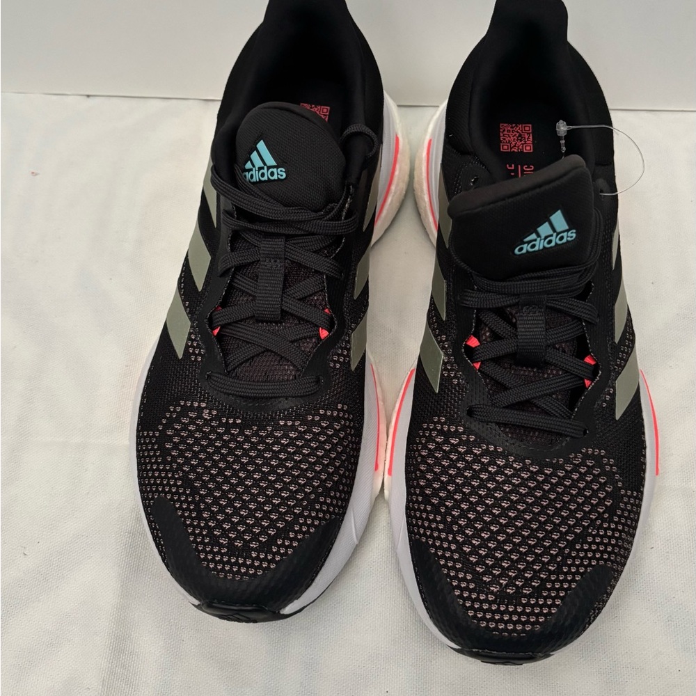 Adidas Black and White Sneakers with Breathable Mesh and Structured Toe